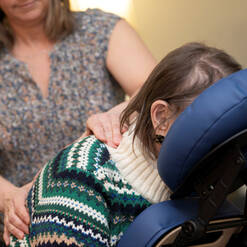 A person giving another person a massage