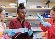 3 women in laboratory setting 