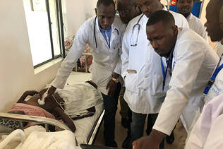 Doctors at Butaro Cancer Center of Excellence (BCCOE) in Butaro, Rwanda, being trained in bedside ultrasound.