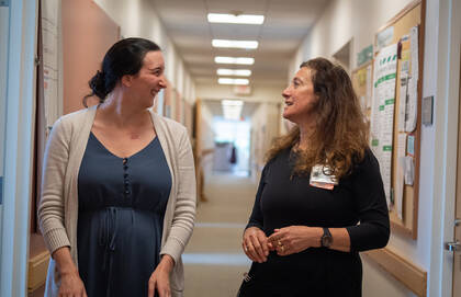  Jennifer A. Tabiri, MSN, APRN, left, talking to Ilana Cass, MD