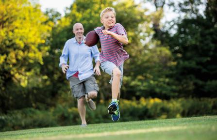 Jack Deliso playing football with his dad.