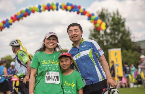 Participants under the balloon arch at The Prouty