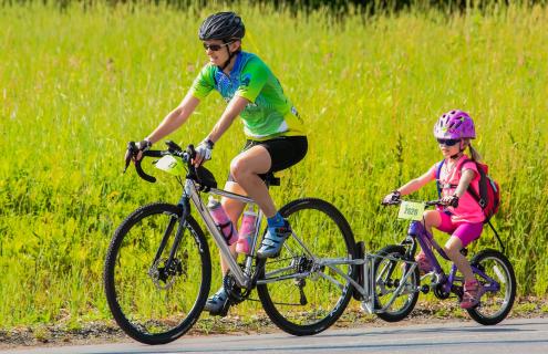 Woman and child biking The Prouty