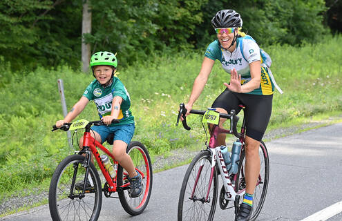 Women and child riding bikes.