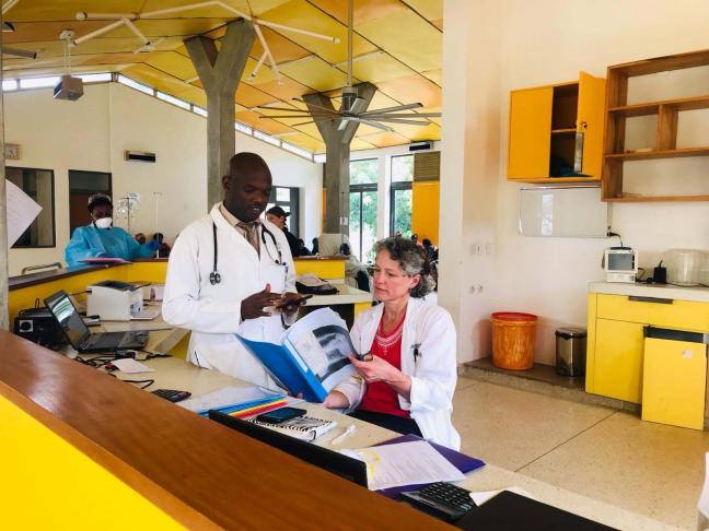 Mary Chamberlin in Rwanda with John Butonzi, visiting resident to DHMC in 2015